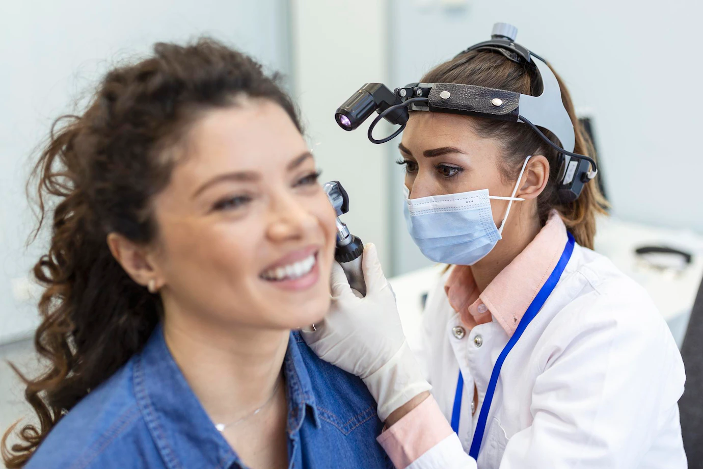 hearing-exam-otolaryngologist-doctor-checking-woman